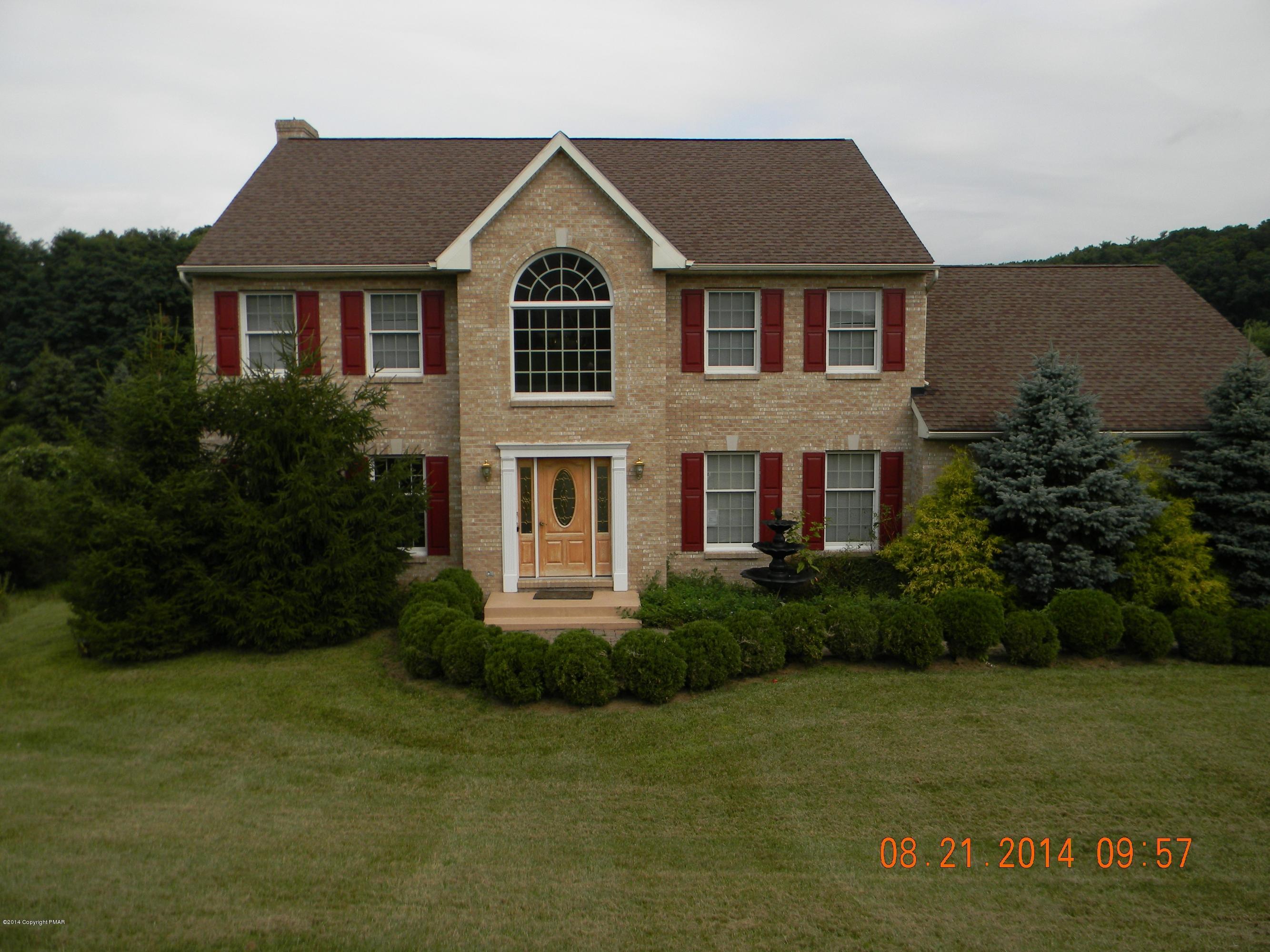 5513 Bridle Road Stroudsburg, PA 18360 - Photo 1 of 15 a front view of a house with a yard