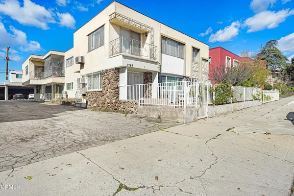 a front view of a building with street view