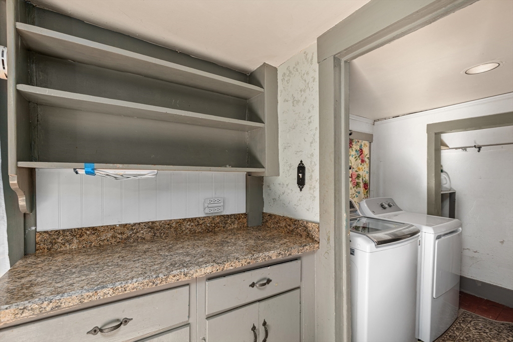 52 Salem Street Reading, MA 01867 - Photo 12 of 26 a kitchen with granite countertop a sink and a stove