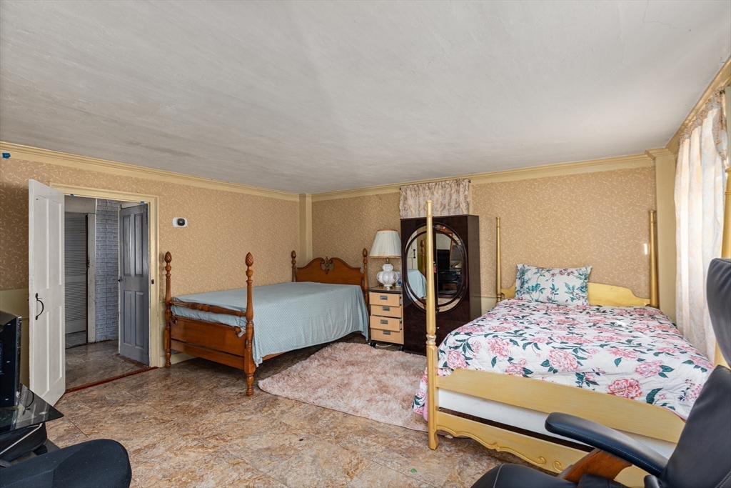 52 Salem Street Reading, MA 01867 - Photo 13 of 26 a bedroom with a bed and a bathroom
