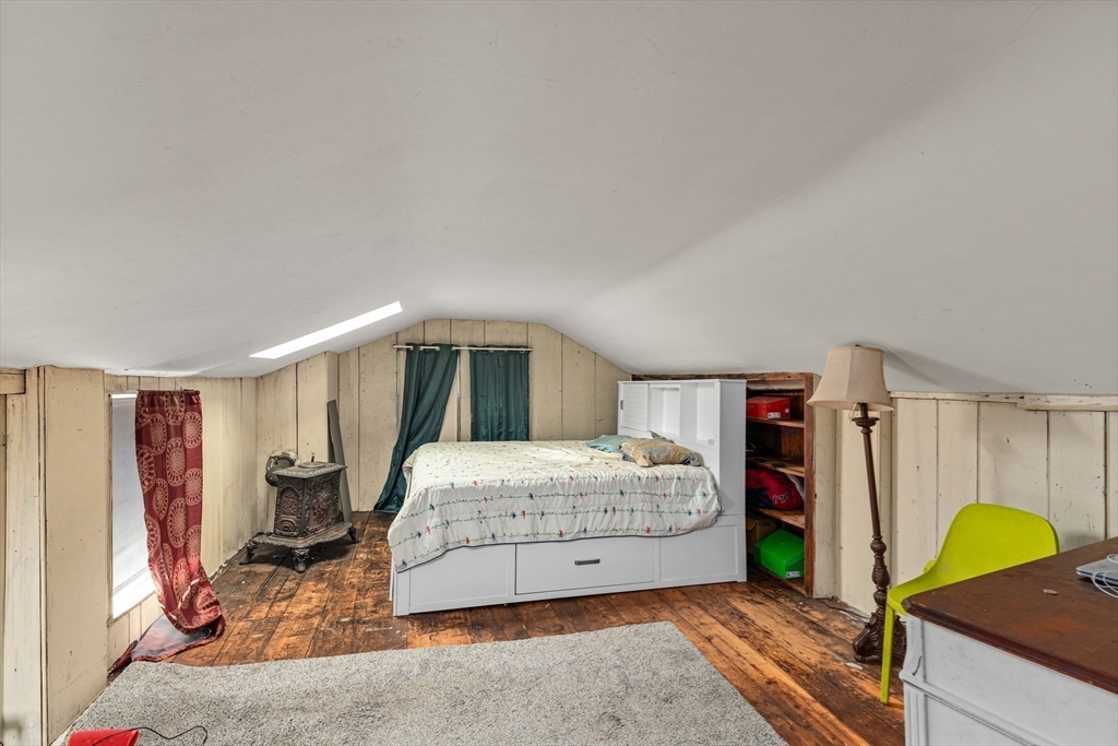 52 Salem Street Reading, MA 01867 - Photo 21 of 26 a spacious bedroom with a bed and a window