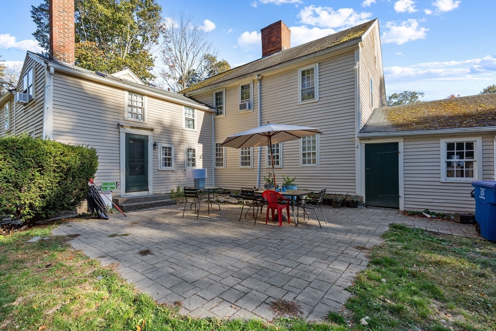 52 Salem Street Reading, MA 01867 - Photo 24 of 26 a view of a house with backyard and chairs