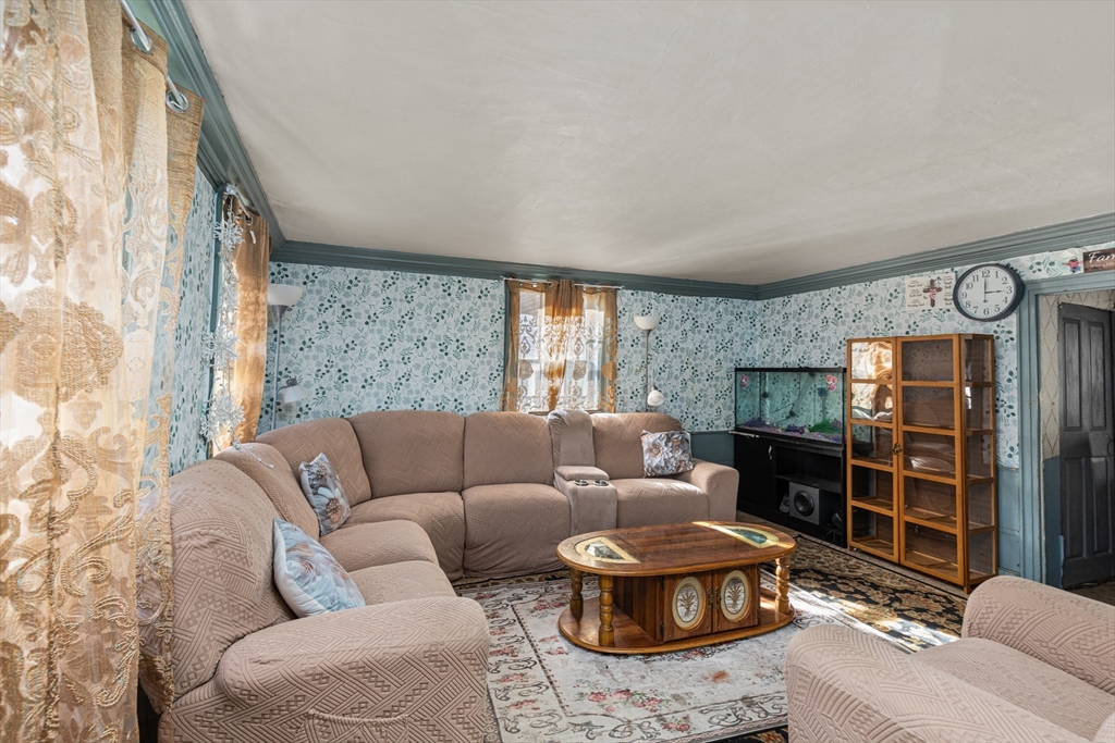 52 Salem Street Reading, MA 01867 - Photo 3 of 26 a living room with furniture and a window