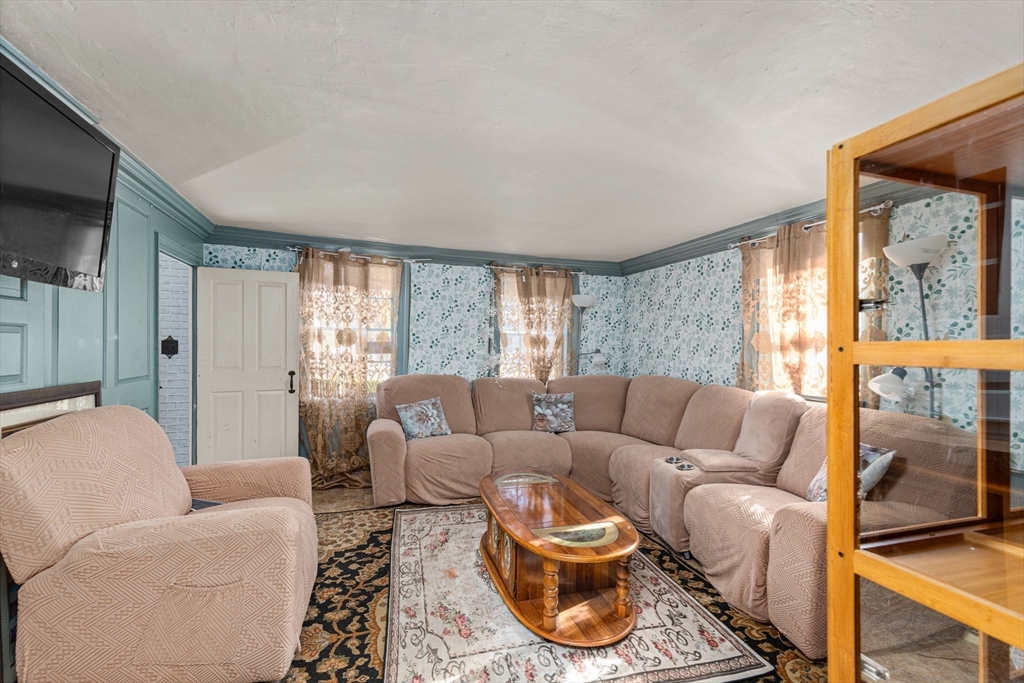 52 Salem Street Reading, MA 01867 - Photo 5 of 26 a living room with furniture and a large window