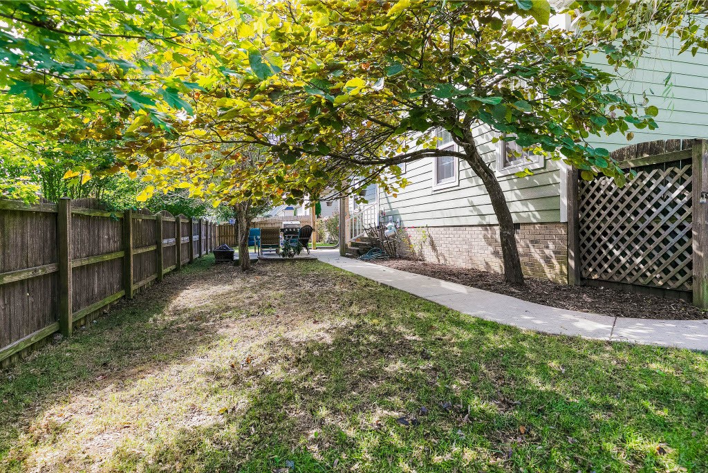 124 Riley Creek Road Tullahoma, TN 37388 - Photo 27 of 30 a backyard of a house with table and chairs