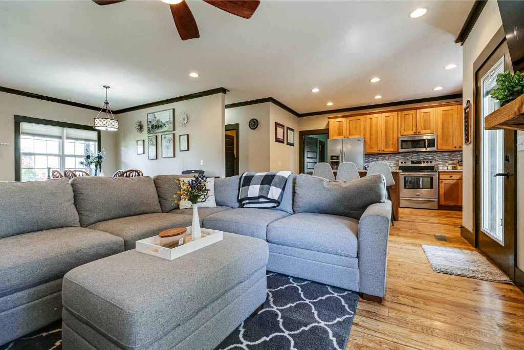 124 Riley Creek Road Tullahoma, TN 37388 - Photo 7 of 30 a living room with furniture a ceiling fan and a rug