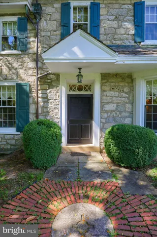 a view of a house with a backyard and a patio
