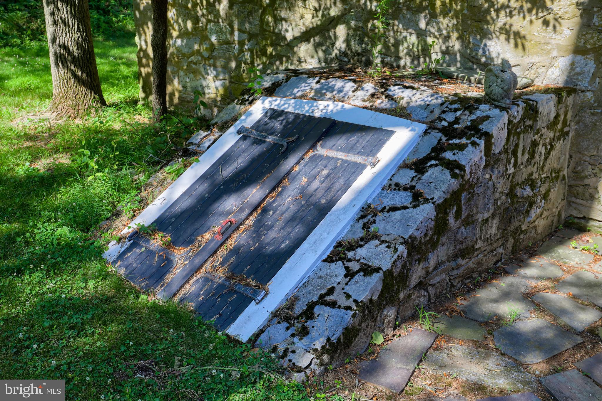 140 Evans Hill Road Reading, PA 19608 - Photo 32 of 70 a view of a yard with plants and a wooden bench