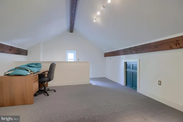 a view of a green field with clear sky