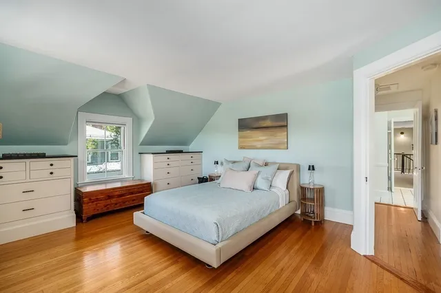 a bedroom with a bed and a dresser