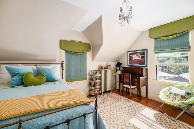 a bedroom with a bed and a table in it