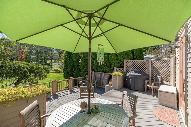 an outdoor space with furniture and umbrella