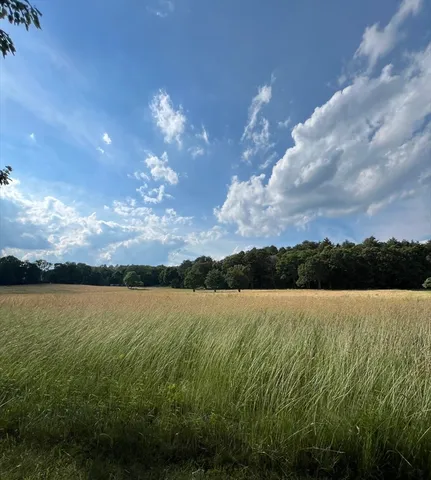 a view of mountain with lake view