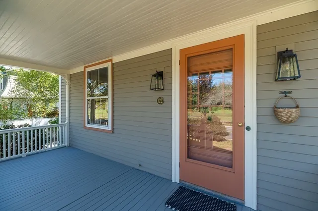 a view of front door and wooden floor