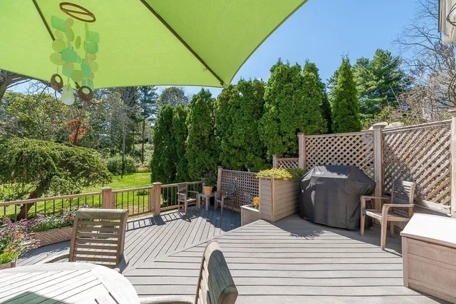 a view of a roof deck with furniture