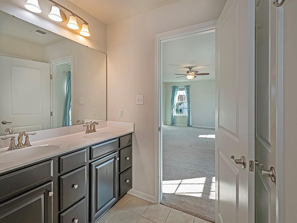 2002 Bald Eagle Court Valencia, PA 16059 - Photo 27 of 42 a bathroom with a sink a mirror and a shower