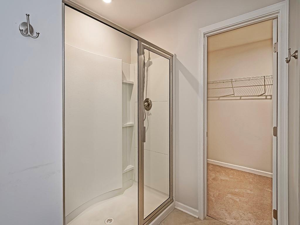 2002 Bald Eagle Court Valencia, PA 16059 - Photo 28 of 42 a bathroom with a glass shower door
