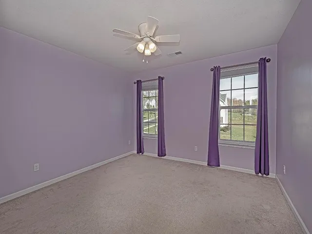 a view of an empty room with window