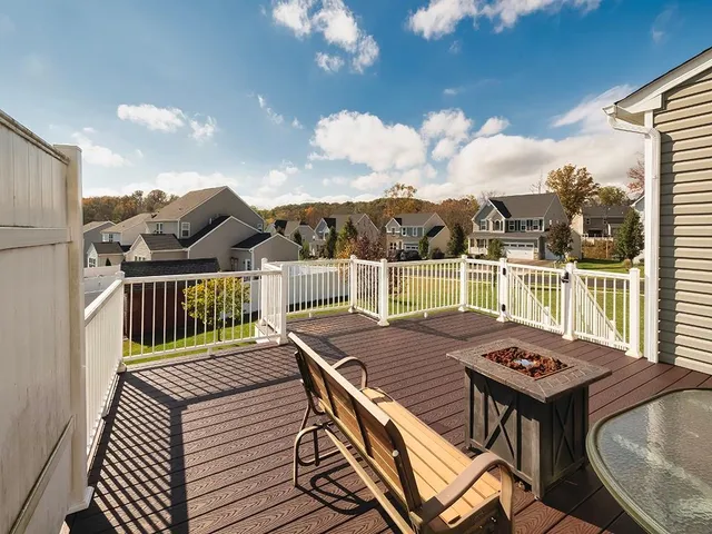 a view of a balcony with two chairs