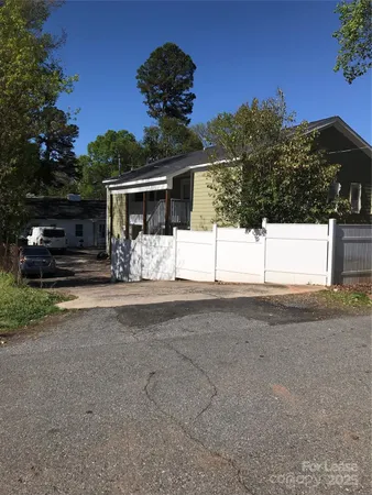 a view of a house with a street