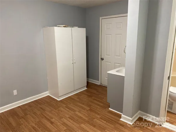a view of a bathroom with a sink and a mirror