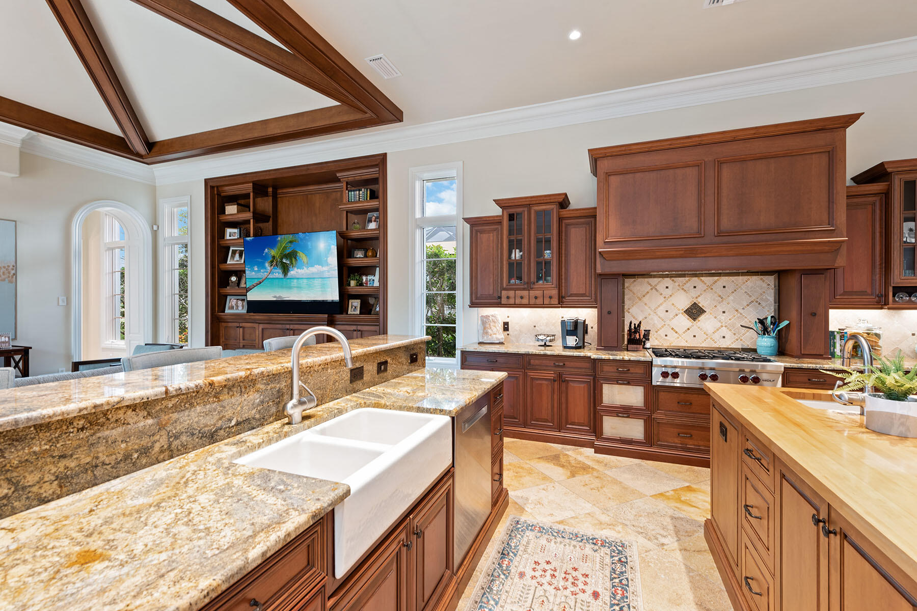 3855 Isla Del Sol Way Naples, FL 34114 - Photo 11 of 50 a kitchen with granite countertop lots of counter top space and a sink