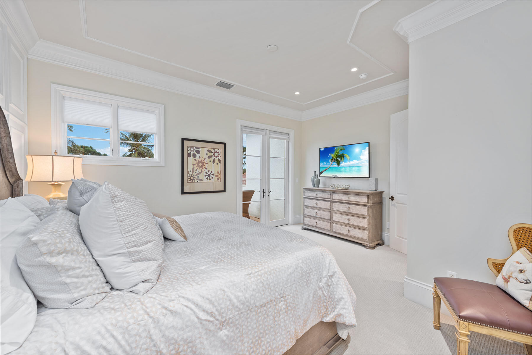 3855 Isla Del Sol Way Naples, FL 34114 - Photo 24 of 50 a bedroom with a bed and a flat screen tv