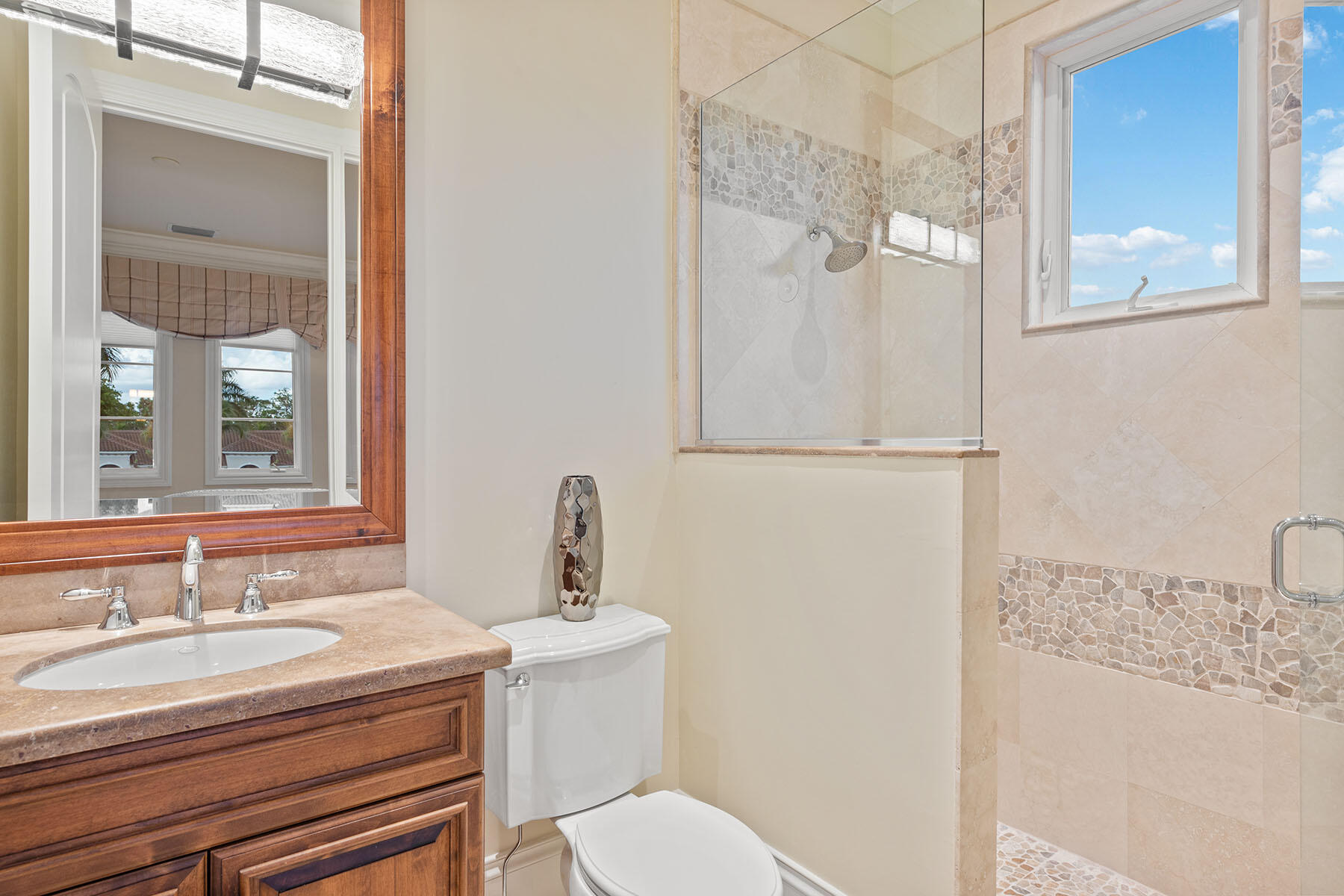 3855 Isla Del Sol Way Naples, FL 34114 - Photo 25 of 50 a bathroom with a sink toilet and shower