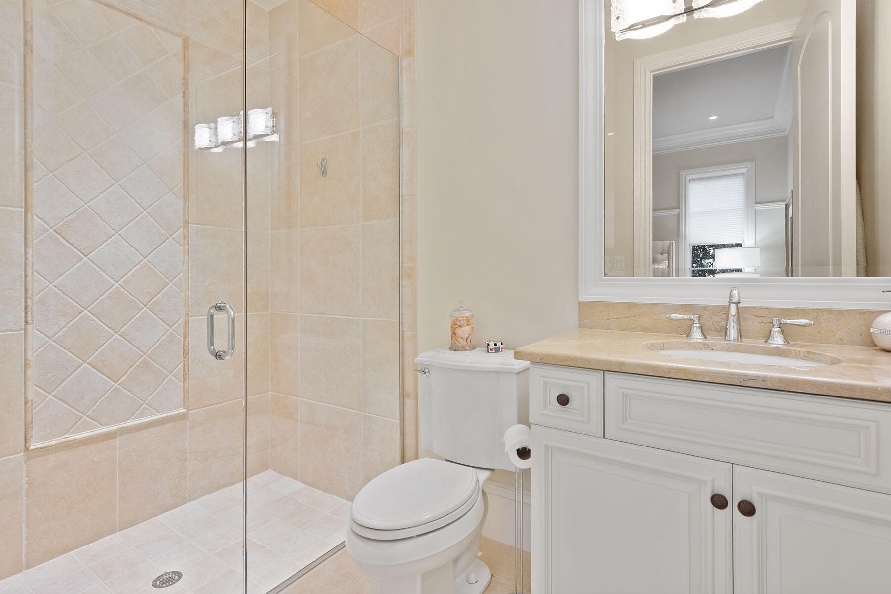 3855 Isla Del Sol Way Naples, FL 34114 - Photo 28 of 50 a bathroom with a granite countertop sink a toilet and shower