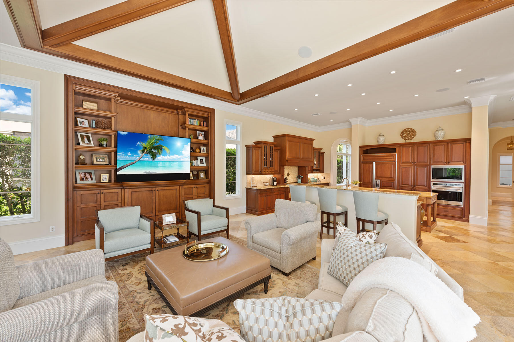 3855 Isla Del Sol Way Naples, FL 34114 - Photo 32 of 50 a living room with furniture and a flat screen tv