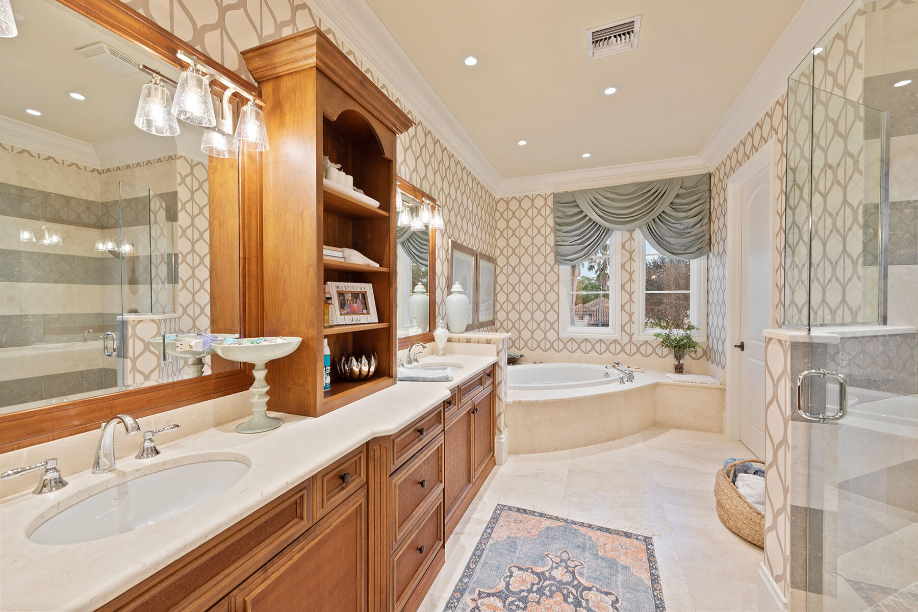 3855 Isla Del Sol Way Naples, FL 34114 - Photo 35 of 50 a bathroom with a granite countertop double vanity sink a bathtub and next to a window