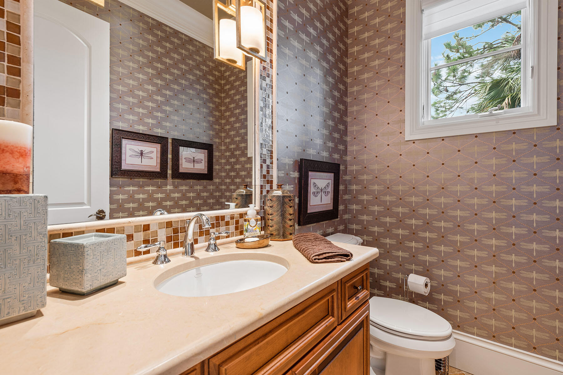 3855 Isla Del Sol Way Naples, FL 34114 - Photo 36 of 50 a bathroom with a granite countertop toilet a sink and a mirror
