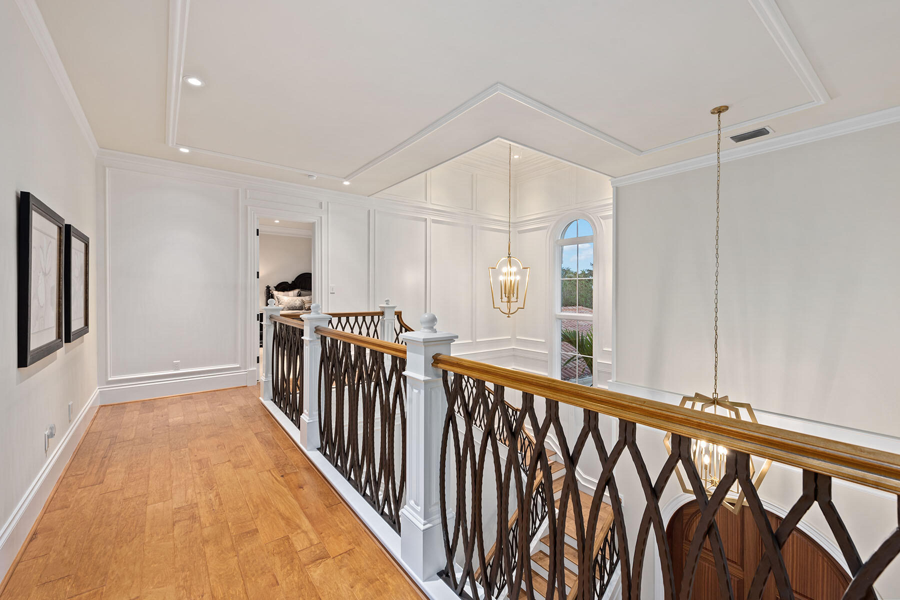 3855 Isla Del Sol Way Naples, FL 34114 - Photo 38 of 50 a view of a hallway with wooden floor and staircase