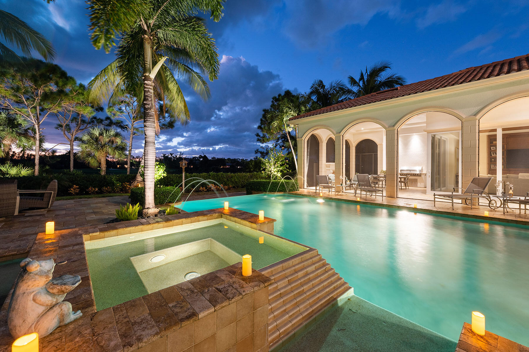 3855 Isla Del Sol Way Naples, FL 34114 - Photo 43 of 50 a view of a house with pool and chairs