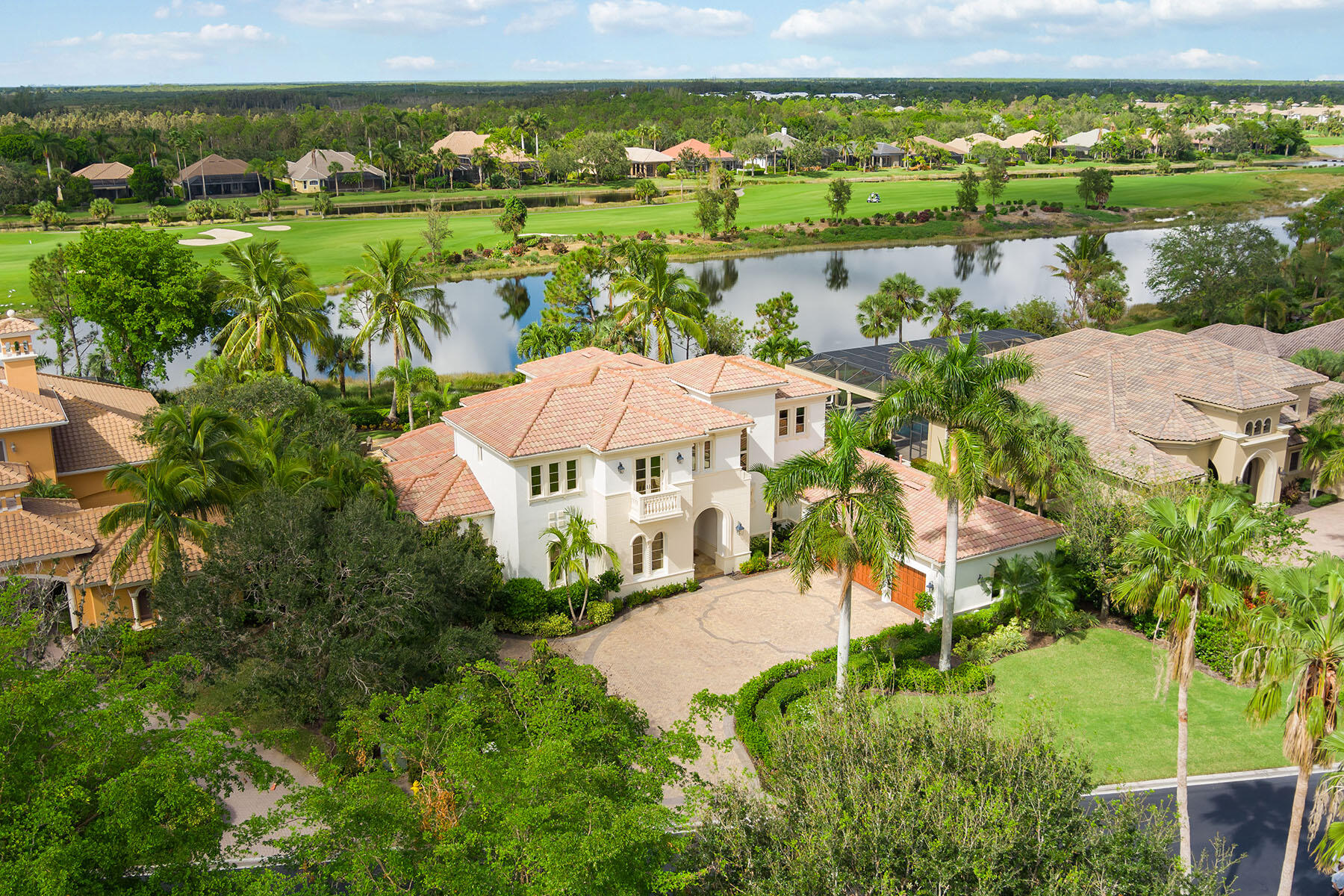 3855 Isla Del Sol Way Naples, FL 34114 - Photo 44 of 50 an aerial view of a house with a lake view