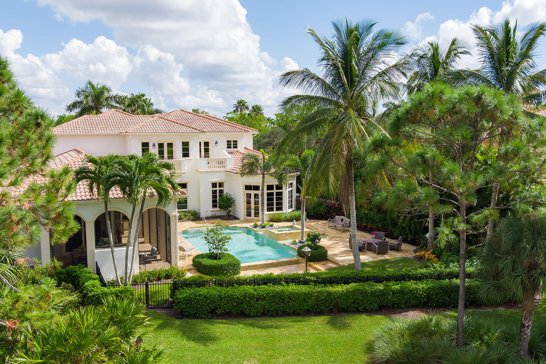 3855 Isla Del Sol Way Naples, FL 34114 - Photo 48 of 50 a front view of a house with a garden