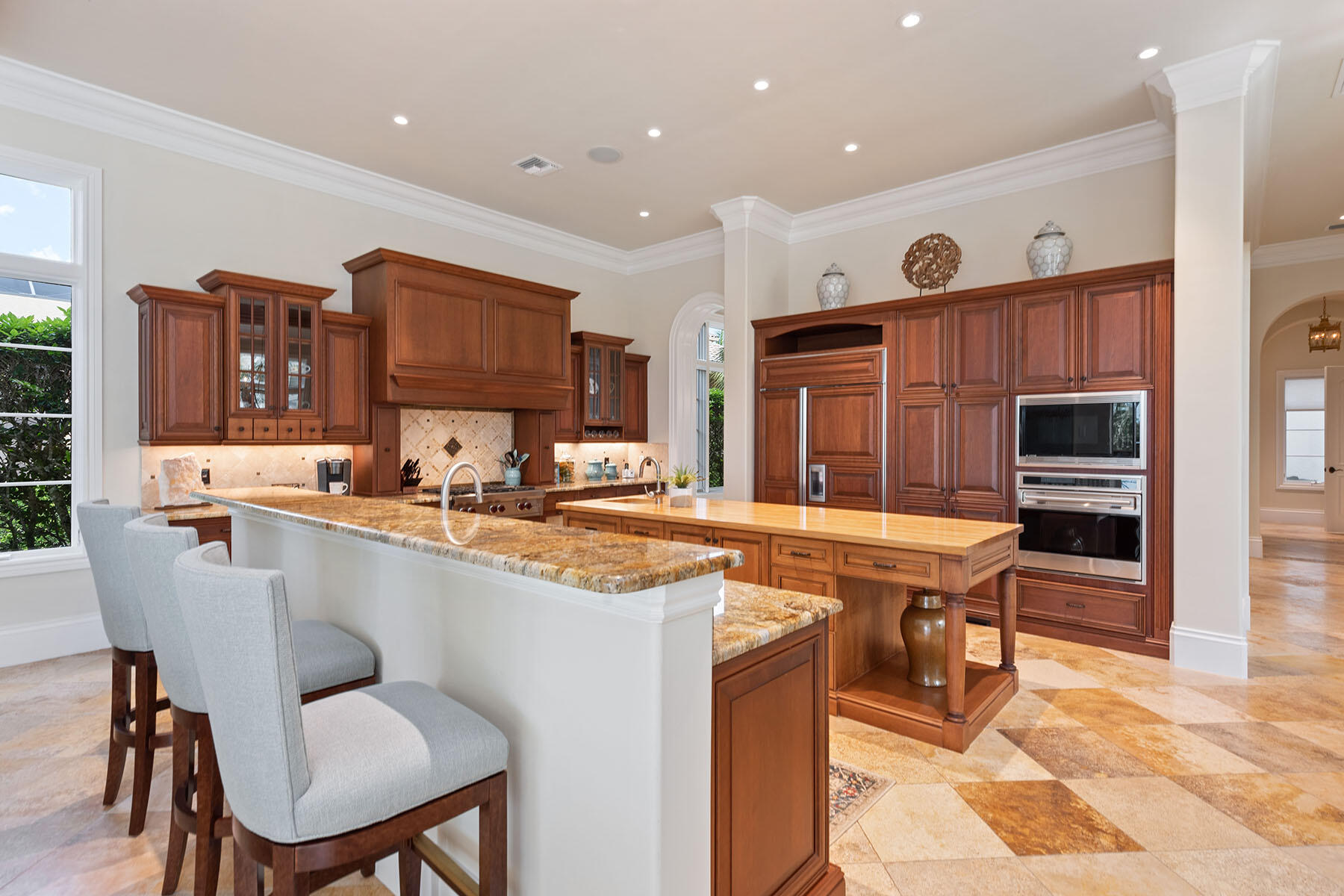 3855 Isla Del Sol Way Naples, FL 34114 - Photo 8 of 50 a kitchen with stainless steel appliances granite countertop a sink and a refrigerator