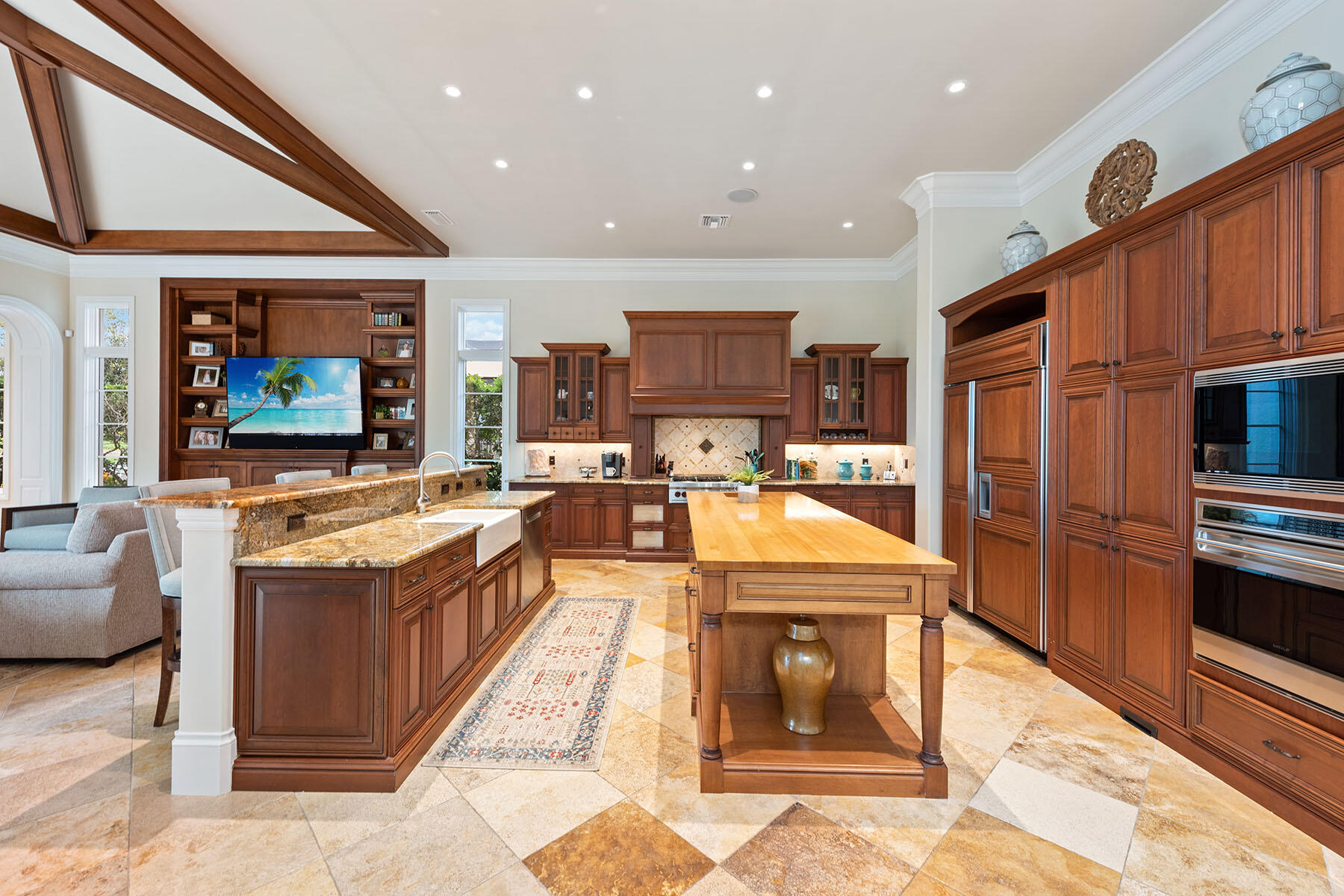 3855 Isla Del Sol Way Naples, FL 34114 - Photo 9 of 50 a large kitchen with stainless steel appliances granite countertop a large stove a sink and dishwasher