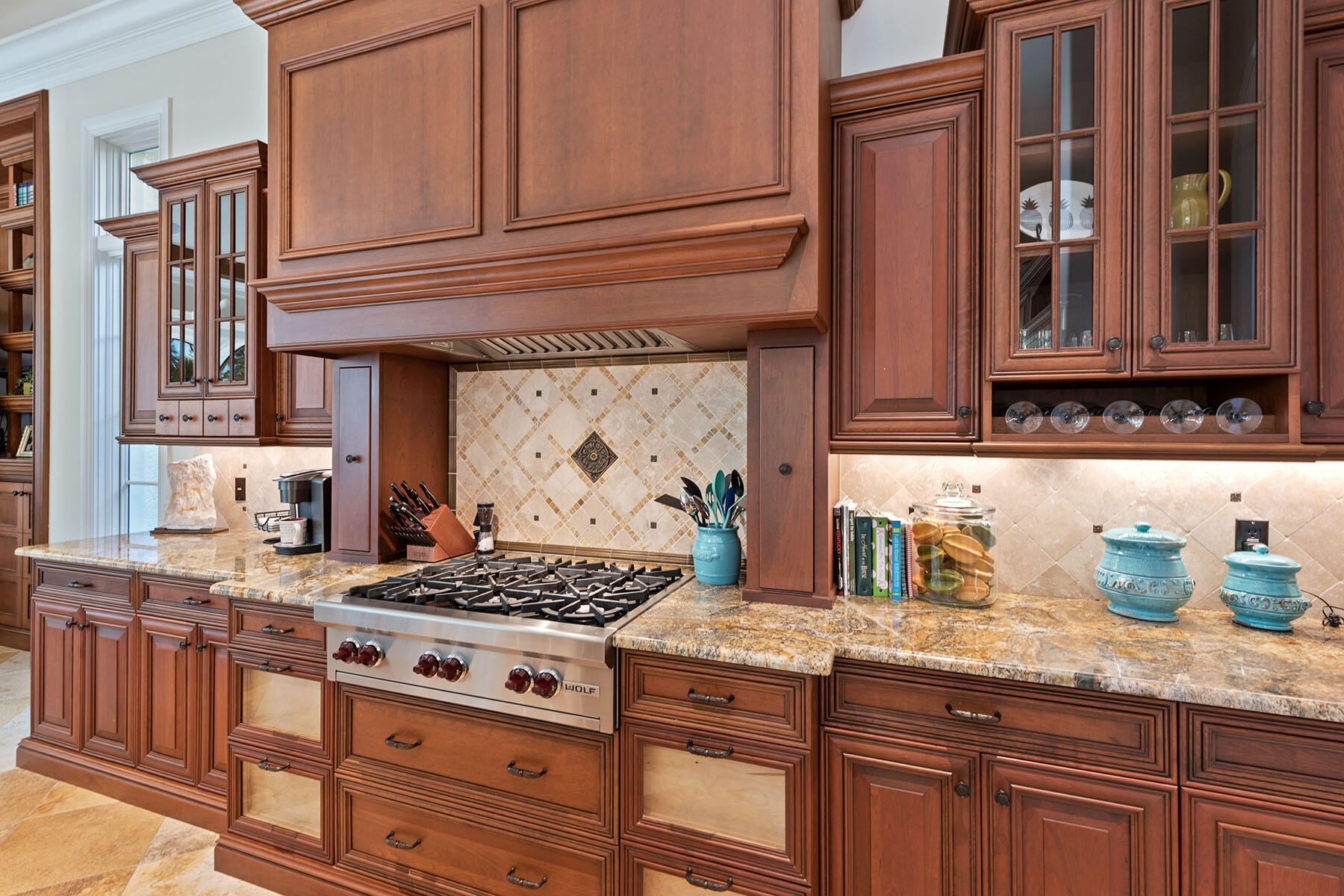 3855 Isla Del Sol Way Naples, FL 34114 - Photo 10 of 50 a kitchen with granite countertop stainless steel appliances stove top oven and cabinets