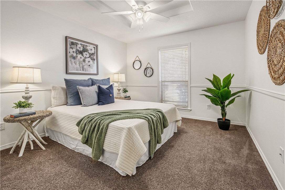 406 Cold Spring Drive College Station, TX 77845 - Photo 20 of 32 a bedroom with a bed and a chandelier