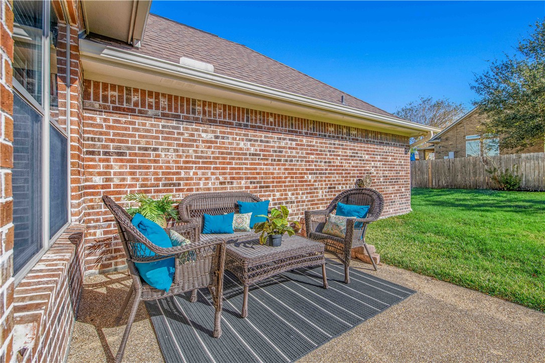 406 Cold Spring Drive College Station, TX 77845 - Photo 29 of 32 a patio with table and chairs and potted plants