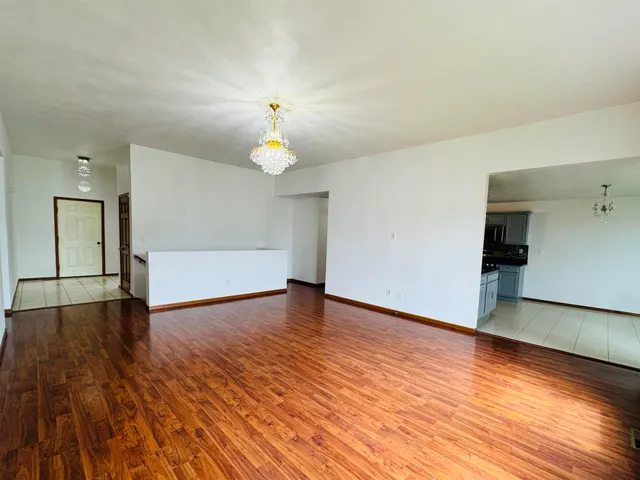a large kitchen with cabinets and stainless steel appliances