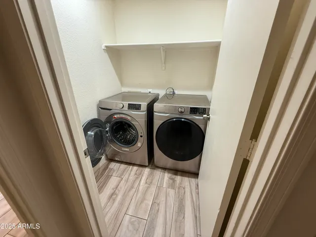 a utility room with dryer and washer