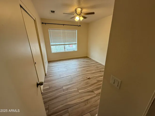 a view of an empty room with a window