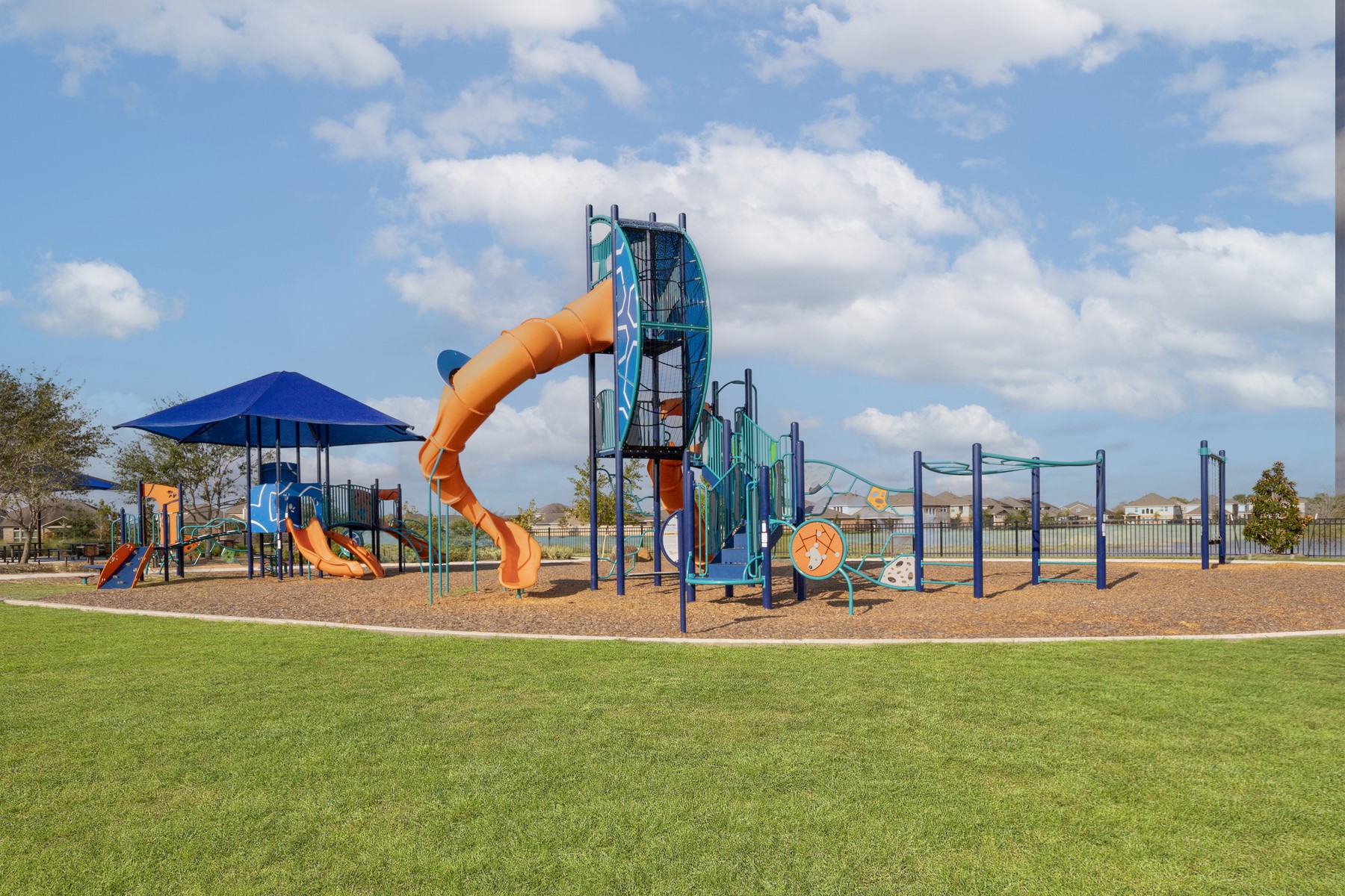 10622 Sutter Crk Drive Rosharon, TX 77583 - Photo 23 of 28 The community playground in Sierra Vista is a kid's dream, featuring multiple slides, climbing structures, and shaded areas, all meticulously maintained and surrounded by lush green space.