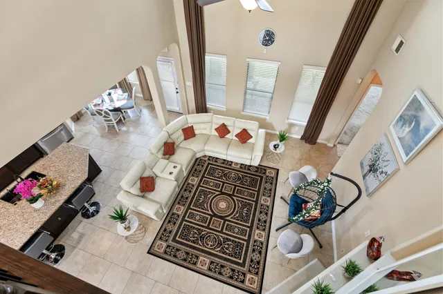 a view of living room with furniture and a fireplace