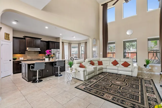 a living room with furniture fireplace and flat screen tv