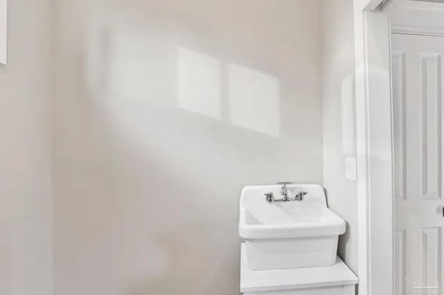 a bathroom with a sink and mirror