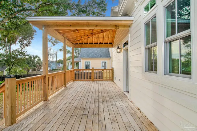 a view of a balcony with wooden floor