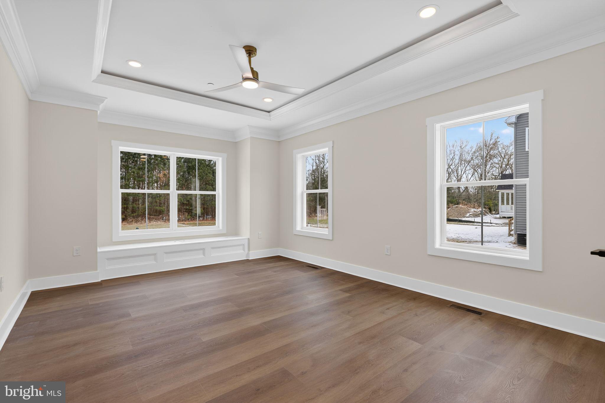 27458 Mooring Way Salisbury, MD 21801 - Photo 15 of 32 a view of an empty room with wooden floor and a window